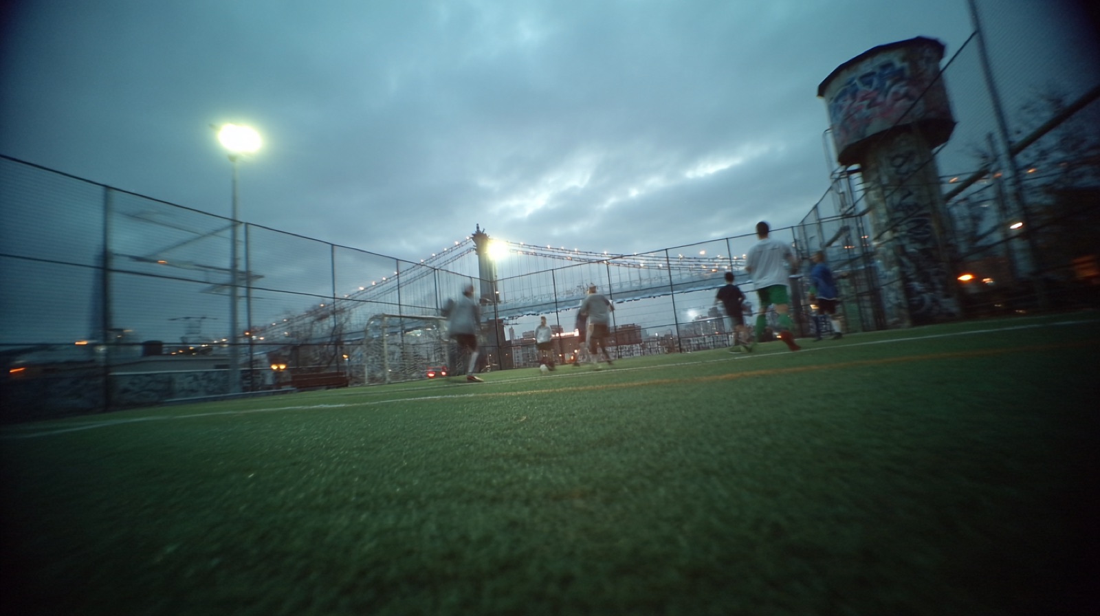 Pitch installation at dusk with atmospheric lighting